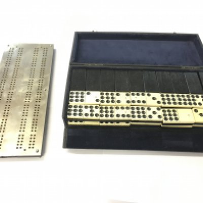 Leather boxed antique brass cribbage board and domino set.- NO RESERVE