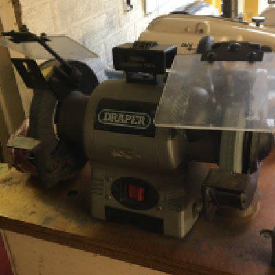 A Draper bench top double grinder seen working and only lightly used, Viewing by appointment sold in situ buyer to collect RM15 South Ockendon.- NO RESERVE