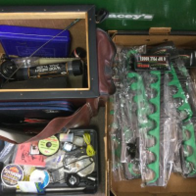 A collection of vintage fishing equipment including rods. Shipping category D.- NO RESERVE