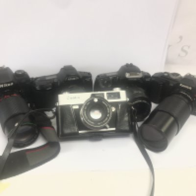 5 Vintage cameras including Nikon, Canon, Minolta, Konica