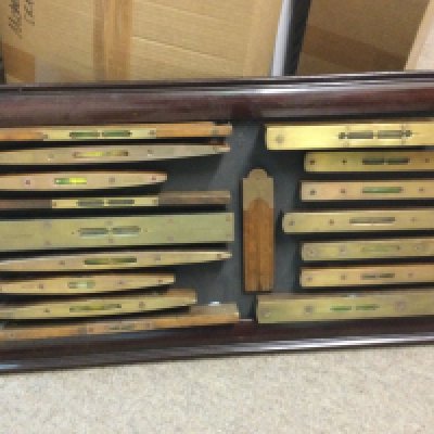 A framed display of 16 vintage spirit levels . This lot cannot be posted