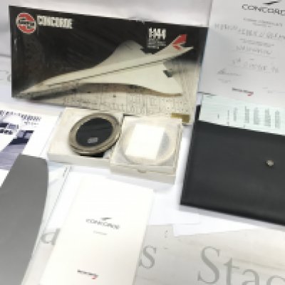 A Collection of assorted Concorde memorabilia including two silver frames. Postage B