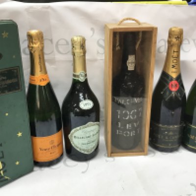 A collection of champagne including Moet & Chandon, Royal Oporto 1967 port, 1991 Billecart Salmon, Veuve Clicquot champagne . This lot cannot be posted