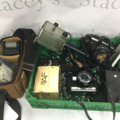 A small collection of cameras and accessories including a Nikon F-501. Shipping category D.