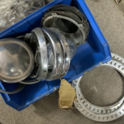 Vintage Mini Cooper parts. A large collection of chrome light mounts, Lights, chrome trims, and other body accessories.