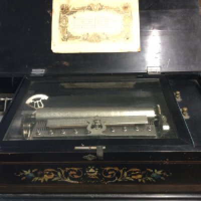 A Victorian 12 aire music box with later decoration.
