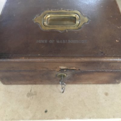 A Churchill family leather and brass cigar box the hinge lid impressed With The Duke of Marlborough inset with a detector action Chubb lock .