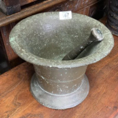 A 17th or 18th bronze pestle and mortar, 27cm x 20cm
