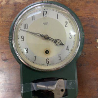 A Vintage 1950s green enamelled metal smiths wall clock, 26cm.