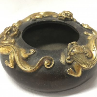 A Chinese three gilt dragon bronze censor with a four character mark at base. 4cm tall 9cm wide. Postage category A