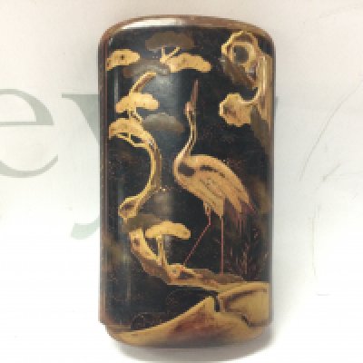 A Japanese tortoiseshell cigar case with embossed decorated giltwork and orient animal design. 12cm tall. Postage category B