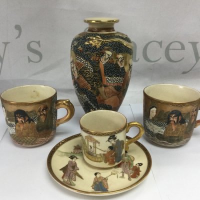 A small Japanese Satsuma vase, three cups and a saucer (5). Shipping category D.