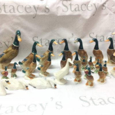 A large collection of Beswick and other duck and swan figures . Also including a boxed Wedgwood waiting for The Times plate and a boxed Coalport the times mug. No obvious damage or restoration This lot cannot be posted