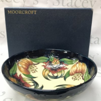 Moorcroft Anna Lily bowl, circa 1998 . No obvious damage or restoration. Crazing seen. 26cm wide 8.5cm tall. This lot cannot be posted