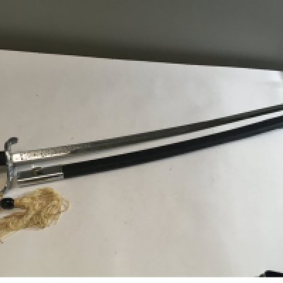 A 20th Century chrome finish cavalry sword ,Quality retrospective collectors copy An American Cavalry sword with elaborate blade engraved United States Marines.