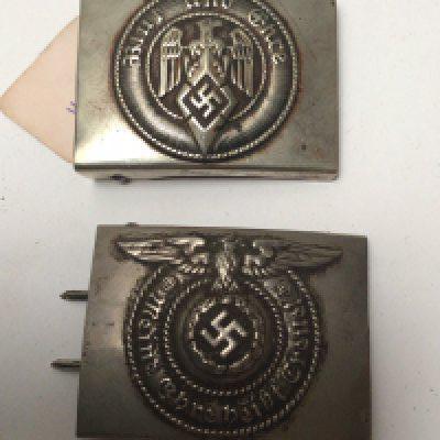 A German Third Reich Hitler Youth belt buckle and a Waffen SS NCO belt buckle both with makers stamps. (2)