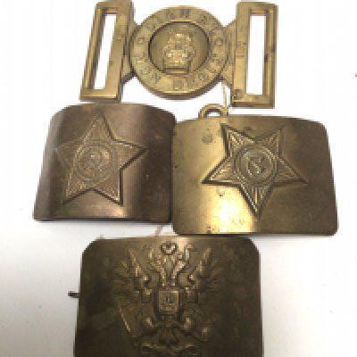 Three Russian brass belt buckles and a British military belt buckle (4)