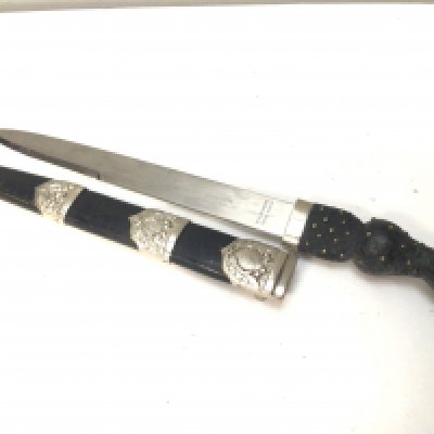 A Scottish Dirk maker Wilkinson Pall Mall the blade with a military symbol. Raised crown pommel.
