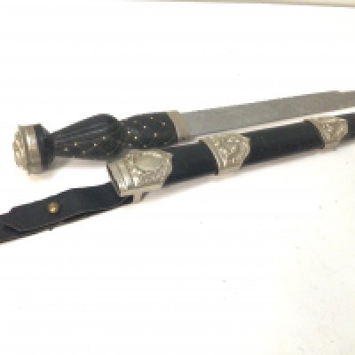 A Scottish Derk with an elaborate etched blade crown pommel.