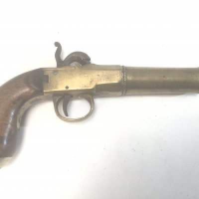 A 19th Century brass canon barrel Percussion pistol with central positioned hammer.