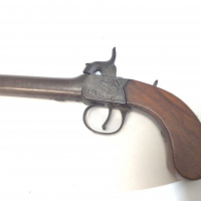 A 19th century Percussion pistol maker Smith London with a detachable barrel with proof marks slab sided. Length 18cm