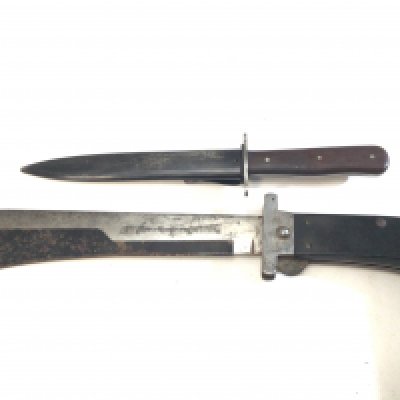 An unusual Camillos folding Machete with blade edge cover length 40cm and a Military fighting knife with steel scabbed and wood grip unmarked (2)