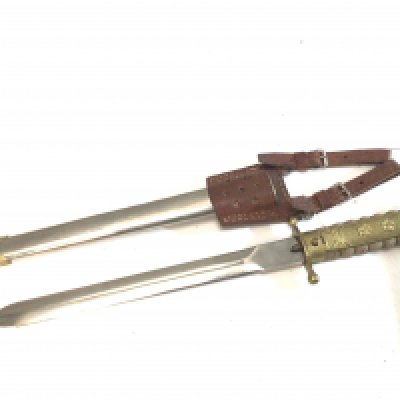 A Rare Chinese Republic Military officers presentation dagger with a shagreen grip with applied gilt metal ornamentation. Leather frog.