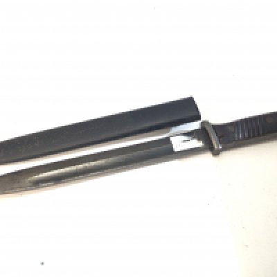 A German Third Reich K98 bayonet the blade stamped 43 fze also numbered 5582 the steel scabbed stamped and dated J.Sch1938.