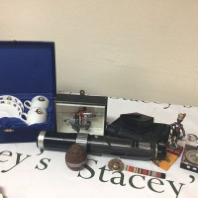 A Collection of Military oddments. badges soldiers a wood sample from HMS Ganges. The last flagship.