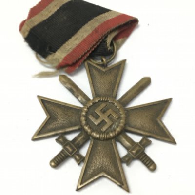 A German Third Reich war merit cross, 1939 and a collection of shield badges including Narvik 1940. postage category A
