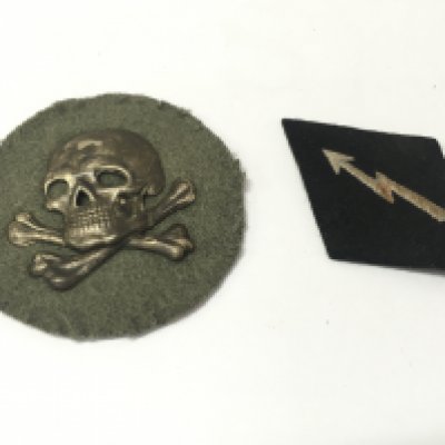 A WW1 German Flammenwerfer (Flame Thrower) Officers sleeve Badge and a WW2 Third Reich SS signals badge . Postage category A NO RESERVE