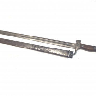 A French 1880 pattern bayonet with a wood grip steel scabbard blade and quilion with stamped marks.