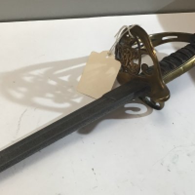 A Victorian British Navy officers sword the brass hinged Guard with Victorian Royal Cypher steel blade with small inset possible makers mark no scabbard.