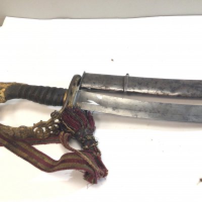 A Rare British Military George III 1803 Sabre. This rare sword with a wired Shagreen grip lion head pommel and with the cypher of George III the curved blade with makers mark to the blade Webe Manufactures 57 Picedills (Piccadilly) London also with the inscriptions Warranted. These swords where bought by officers and not standard Military issue. Used by Infantry flank officers. This example with a steel scabbed length 88cm