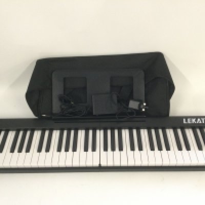 A Lekato folding keyboard with original case and accessories and folding stool (2).