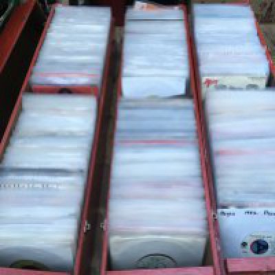 Three long boxes of 700 plus 7" singles by various artists from the 1960s onwards including some promo discs.