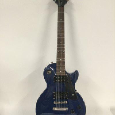 An as new condition Epiphone Les Paul Studio electric guitar in Blue. Twin Humbuckers and rosewood board with chrome parts and brightwork. As new condition unplayed with plastic still on the pick guard. Comes with original Epiphone branded hard carry case.