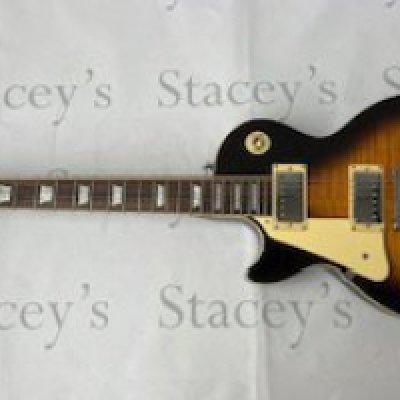 An Epiphone by Gibson Les Paul Standard type left handed electric guitar in Tobacco Sunburst with flame maple top. All original with light play-wear and light marking. Overall very good condition, Comes with non original hard case  Click Here to Register to bid