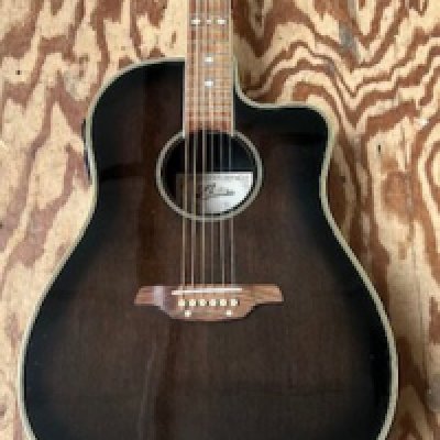 An Aria Electro Acoustic MBA 20 RHC Electro Acoustic Guitar in smoke grey. Good played condition with small chips to headstock.