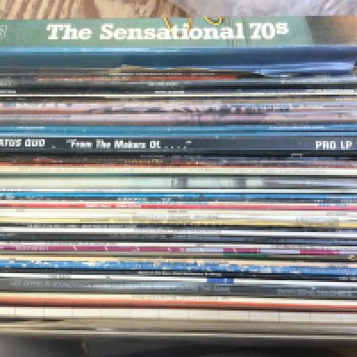 A collection of LPs by various artists including The Beatles, Pink Floyd, Led Zeppelin and others.