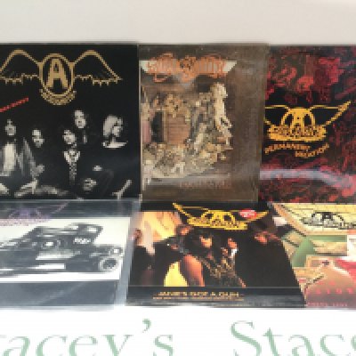 Four Aerosmith LPs and two 12" singles including 'Toys In The Attic', 'Pump' and others.