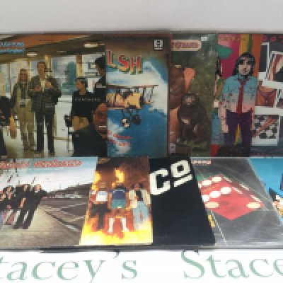 A record case of rock and pop LPs by various artists including Bad Company, Little River Band, Mountain and others.