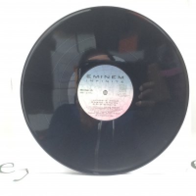 A scarce 2000 reissue of the Eminem 'Infinite' LP. No sleeve. VG+.