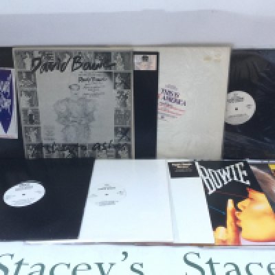 Two bags containing a collection of David Bowie promotional 12" singles including 'Heroes', 'China Girl', 'Under Pressure' and others.