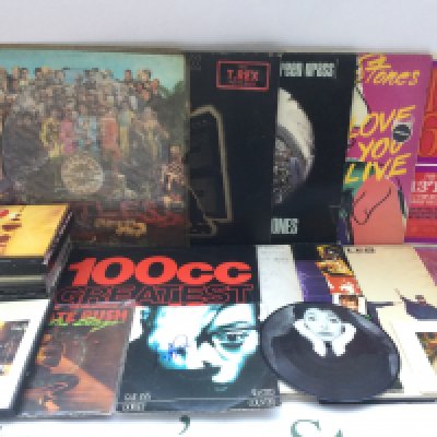 A collection of LPs and CDs by various artists including The Beatles, Kate Bush, David Bowie and others.
