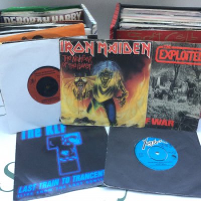Four record cases by various artists including The Rolling Stones, Iron Maiden, Dead Kennedys, The Stone Roses and others.