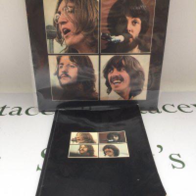 An early UK pressing of The Beatles 'Let It Be' LP together with the Get Back book that was initially part of the Let It Be first pressing box set.