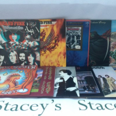 Two bags containing a collection of 23 rock LPs by various artists including Atomic Rooster, Little Feat, Grand Funk and others. Includes two promo copies.