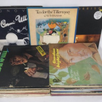 A record case of folk rock LPs by various artists including Donovan. Cat Stevens, Tom Paxton and others,