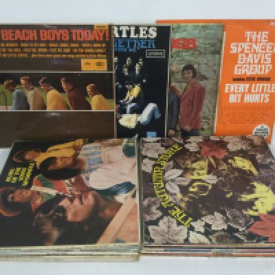 A record case of 1960s rock and pop LPs by various artists including The Beach Boys, The Turtles, The Spencer Davis Group and others.
